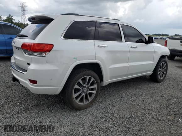 2018 Jeep Grand Cherokee High Altitude with VIN 1C4RJFCT1JC452696, listed as a Copart auction lot 62885035 with 112,998 mi miles and Salvage title. Bid and sale history available at DreamBid. Image 3.