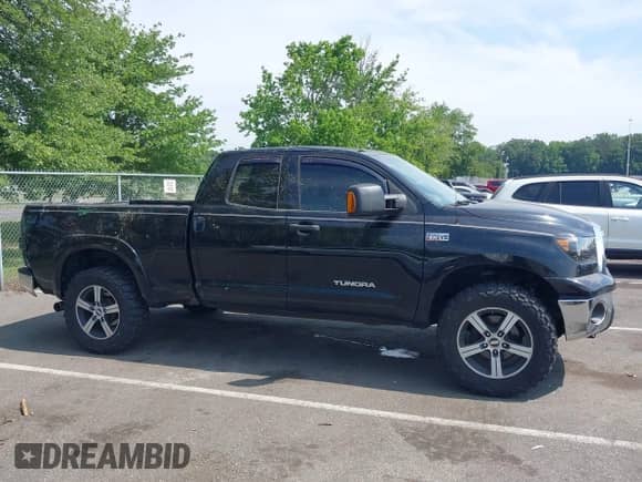 2012 Toyota Tundra z VIN 5TFRY5F10CX117652, wystawiony jako IAAI lot #42617080 z przebiegiem 233 560 mil mil oraz . Historia ofert i sprzedaży dostępna na DreamBid. Obrazek 13.
