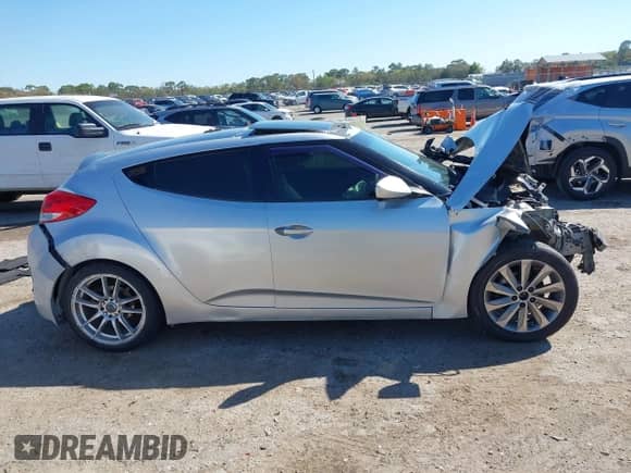 2012 Hyundai Veloster w/Black Int z VIN KMHTC6ADXCU036070, wystawiony jako IAAI lot #41779990 z przebiegiem Nie podano mil oraz . Historia ofert i sprzedaży dostępna na DreamBid. Obrazek 13.