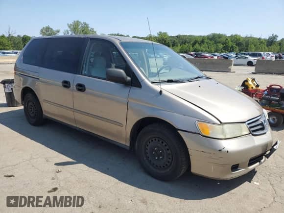2004 Honda Odyssey LX with VIN 5FNRL18534B143388, listed as a Copart auction lot 68346135 with 160,563 mi miles and Salvage title. Bid and sale history available at DreamBid. Image 4.
