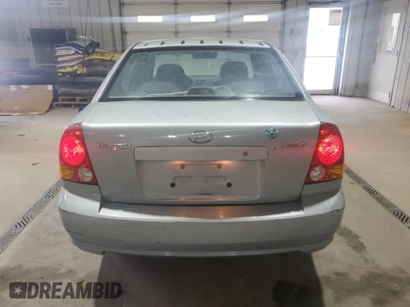 2005 Hyundai Accent GLS z VIN KMHCG45C65U662633, wystawiony jako Copart lot #86432595 z przebiegiem 221 608 mil mil oraz Szkoda całkowita • Salvage title. Historia ofert i sprzedaży dostępna na DreamBid. Obrazek 6.