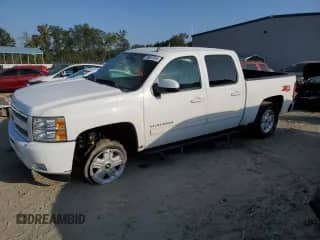 2011 Chevrolet Silverado 1500 LTZ with VIN 3GCPKTE21BG186182, listed as a Copart auction lot 68987834 with 145,388 mi miles and Salvage title. Bid and sale history available at DreamBid. Image 1.