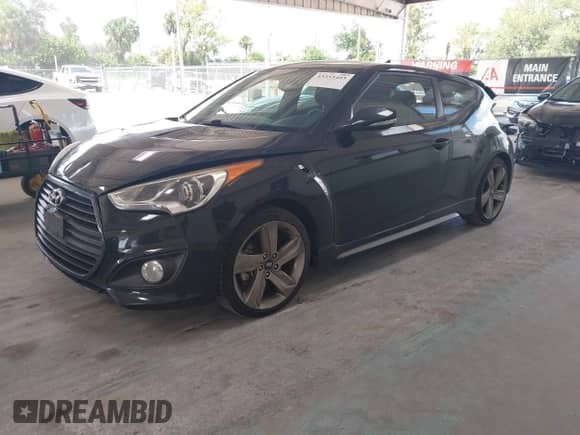 2013 Hyundai Veloster Turbo с VIN KMHTC6AEXDU167848, выставлен на аукционе IAAI как лот 43353403 с пробегом 84 077 миль миль и . История ставок и продаж доступна на DreamBid. Изображение 2.