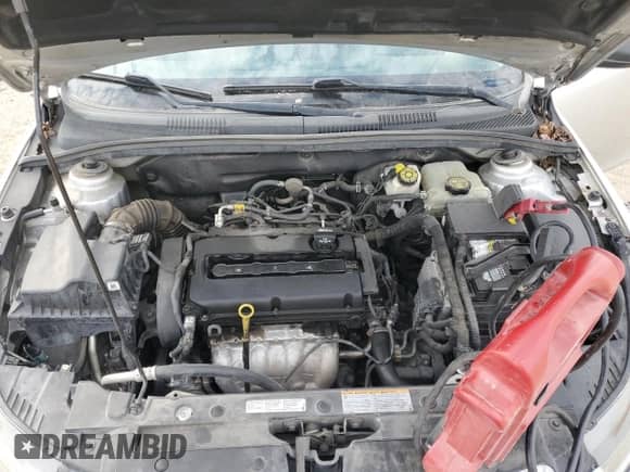 2015 Chevrolet Cruze LS z VIN 1G1PA5SH1F7212524, wystawiony jako Copart lot #81826355 z przebiegiem 174 378 mil mil oraz Szkoda całkowita • Salvage title. Historia ofert i sprzedaży dostępna na DreamBid. Obrazek 11.