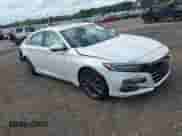 2021 Honda Accord EX-L z VIN 1HGCV1F52MA117975, wystawiony jako IAAI lot #43123963 z przebiegiem 47 990 mil mil oraz . Historia ofert i sprzedaży dostępna na DreamBid. Obrazek 1.