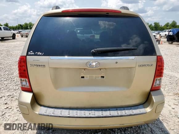 2007 Hyundai Entourage GLS with VIN KNDMC233376033298, listed as a Copart auction lot 68166895 with 154,725 mi miles and Salvage title. Bid and sale history available at DreamBid. Image 6.