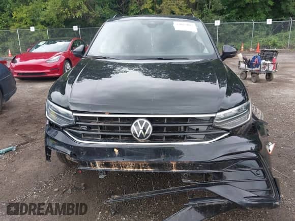 2022 Volkswagen Tiguan SE R-Line Black z VIN 3VV8B7AX7NM165468, wystawiony jako IAAI lot #43027085 z przebiegiem 90 871 mil mil oraz . Historia ofert i sprzedaży dostępna na DreamBid. Obrazek 12.