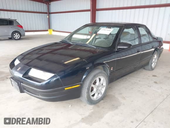 1995 Saturn SL with VIN 1G8ZG5280SZ198686, listed as a IAAI auction lot 42807601 with 294,281 mi miles and . Bid and sale history available at DreamBid. Image 2.