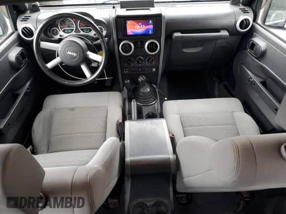 2008 Jeep Wrangler Sahara с VIN 1J8FA54128L521036, выставлен на аукционе Copart как лот 86328185 с пробегом 101 540 миль миль и Списание • Salvage title. История ставок и продаж доступна на DreamBid. Изображение 8.