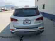 2018 Hyundai Santa Fe 2.0T z VIN 5XYZUDLA3JG536928, wystawiony jako Copart lot #64972905 z przebiegiem 58 297 mil mil oraz Szkoda całkowita • Salvage title. Historia ofert i sprzedaży dostępna na DreamBid. Obrazek 6.