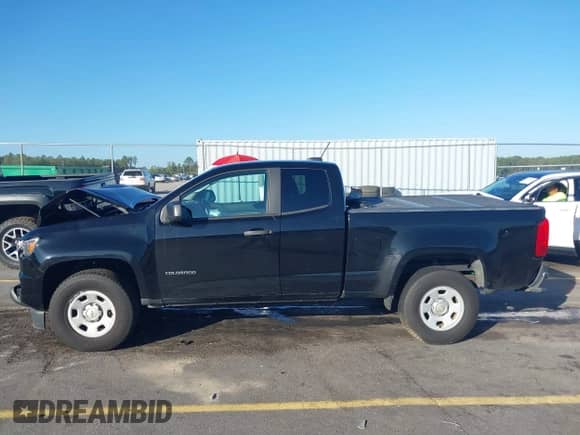 2015 Chevrolet Colorado 2WD WT z VIN 1GCHSAEA0F1173864, wystawiony jako IAAI lot #43349020 z przebiegiem 107 440 mil mil oraz . Historia ofert i sprzedaży dostępna na DreamBid. Obrazek 14.
