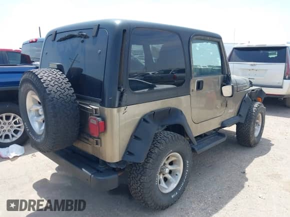 2003 Jeep Wrangler Sport z VIN 1J4FA49S03P326437, wystawiony jako IAAI lot #42702949 z przebiegiem 90 710 mil mil oraz . Historia ofert i sprzedaży dostępna na DreamBid. Obrazek 4.