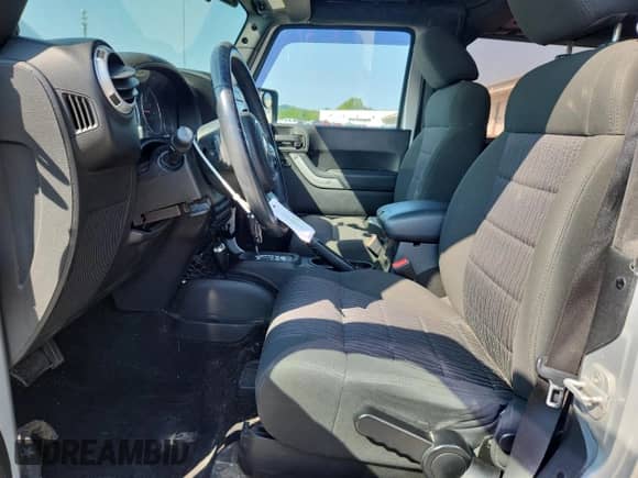 2012 Jeep Wrangler Arctic with VIN 1C4AJWBG5CL230943, listed as a Copart auction lot 59116515 with 94,404 mi miles and Salvage title. Bid and sale history available at DreamBid. Image 7.