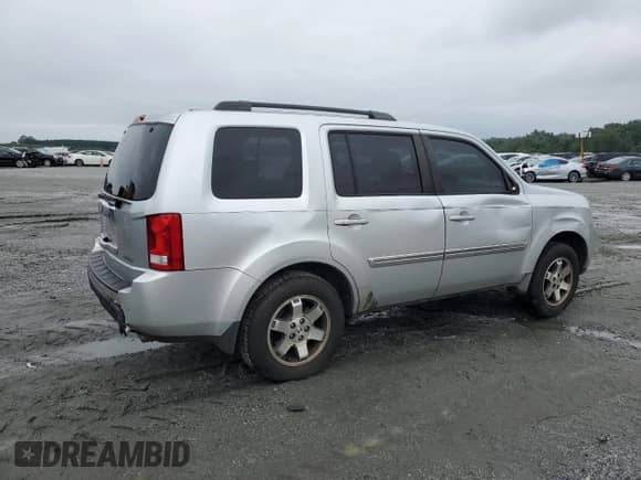2009 Honda Pilot Touring with VIN 5FNYF38839B027611, listed as a Copart auction lot 67812505 with 148,357 mi miles and Salvage title. Bid and sale history available at DreamBid. Image 3.