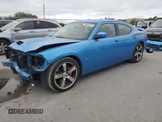 2008 Dodge Charger SRT-8 с VIN 2B3LA73W98H171843, выставлен на аукционе Copart как лот 86603544 с пробегом 61 894 миль миль и Списание • Salvage title. История ставок и продаж доступна на DreamBid. Изображение 1.