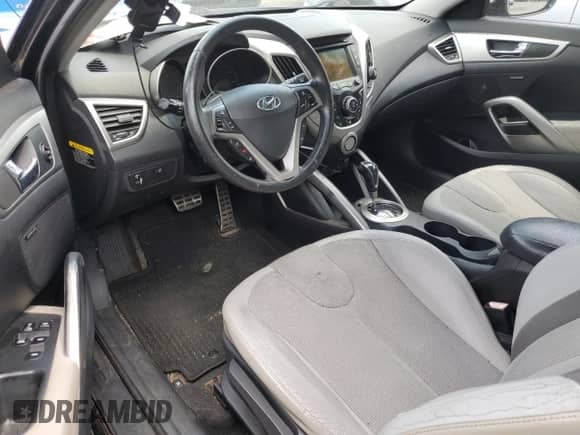 2012 Hyundai Veloster w/Gray Int z VIN KMHTC6AD8CU046631, wystawiony jako Copart lot #68106965 z przebiegiem 120 090 mil mil oraz Szkoda całkowita • Salvage title. Historia ofert i sprzedaży dostępna na DreamBid. Obrazek 8.