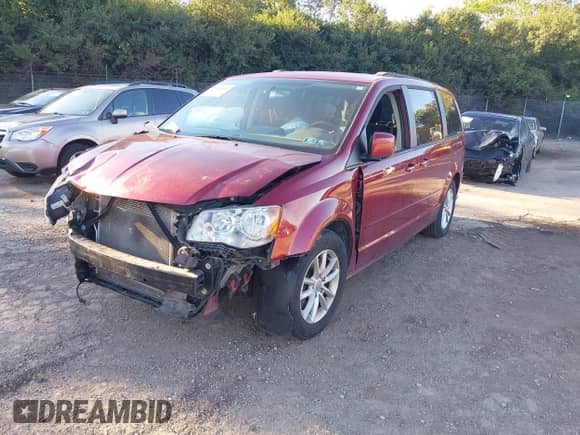 2016 Dodge Grand Caravan SXT with VIN 2C4RDGCG4GR161335, listed as a IAAI auction lot 43414142 with 124,679 mi miles and . Bid and sale history available at DreamBid. Image 2.