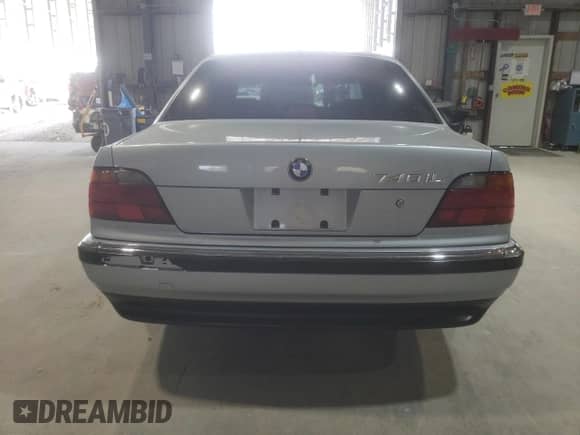 1997 BMW 7 Series 740iL with VIN WBAGJ8321VDM03554, listed as a Copart auction lot 71351095 with 143,449 mi miles and Salvage title. Bid and sale history available at DreamBid. Image 6.