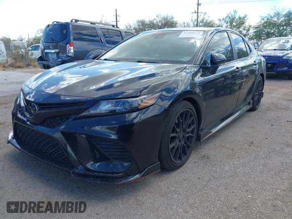 2023 Toyota Camry TRD with VIN 4T1KZ1AK7PU072266, listed as a IAAI auction lot 43208479 with 58,999 mi miles and . Bid and sale history available at DreamBid. Image 6.