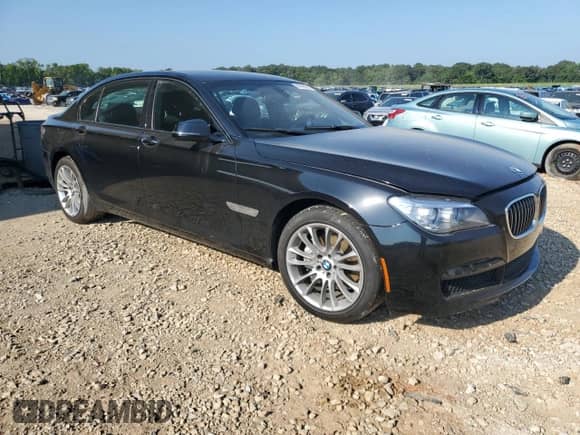 2014 BMW 7 Series 740Li с VIN WBAYE4C50ED137777, выставлен на аукционе Copart как лот 69148825 с пробегом 104 472 миль миль и Списание • Salvage title. История ставок и продаж доступна на DreamBid. Изображение 4.