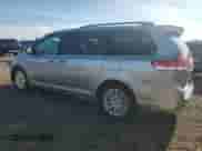 2011 Toyota Sienna XLE with VIN 5TDDK3DCXBS012335, listed as a Copart auction lot 70504025 with 215,782 mi miles and Salvage title. Bid and sale history available at DreamBid. Image 2.