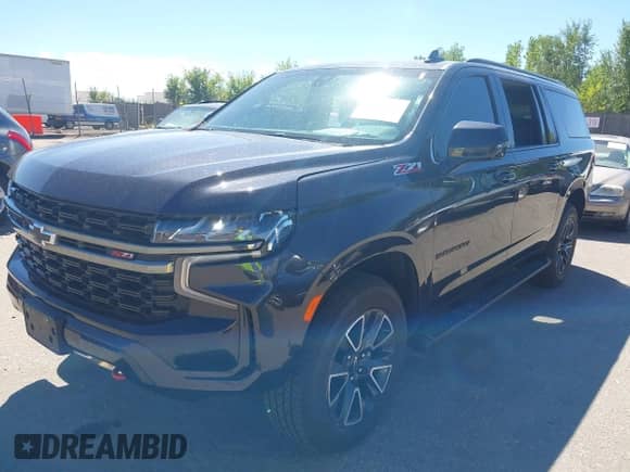 2022 Chevrolet Suburban Z71 z VIN 1GNSKDKD6NR122902, wystawiony jako IAAI lot #43154227 z przebiegiem 37 244 mil mil oraz . Historia ofert i sprzedaży dostępna na DreamBid. Obrazek 2.