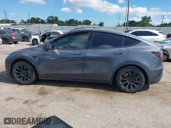 2023 Tesla Model Y Long Range with VIN 7SAYGDEE8PA163534, listed as a IAAI auction lot 42795393 with 45,172 mi miles and . Bid and sale history available at DreamBid. Image 13.