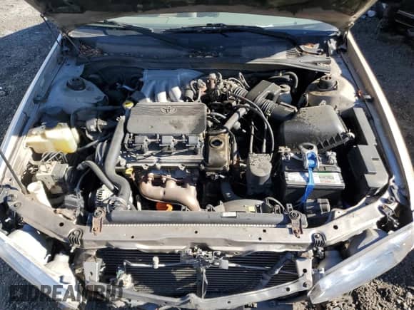 2001 Toyota Camry LE z VIN 4T1BF22KX1U957744, wystawiony jako Copart lot #87041735 z przebiegiem 288 061 mil mil oraz Szkoda całkowita • Salvage title. Historia ofert i sprzedaży dostępna na DreamBid. Obrazek 11.