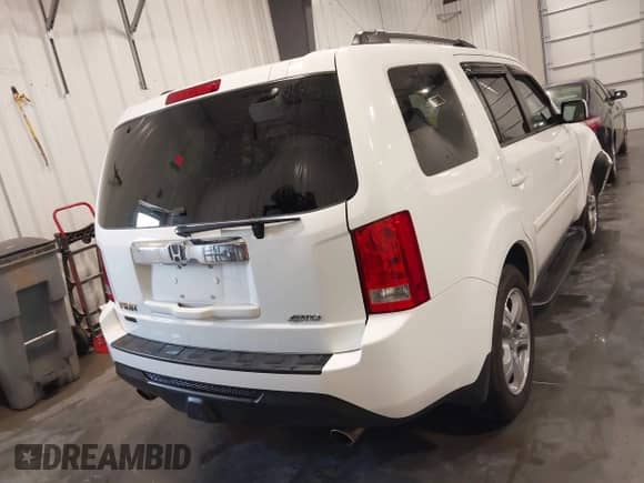 2014 Honda Pilot EX-L with VIN 5FNYF4H5XEB012061, listed as a IAAI auction lot 42216069 with 76,113 mi miles and . Bid and sale history available at DreamBid. Image 16.