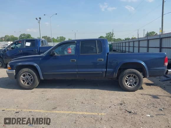 2004 Dodge Dakota SLT with VIN 1D7HL48K74S667977, listed as a IAAI auction lot 42051532 with 92,339 mi miles and . Bid and sale history available at DreamBid. Image 14.