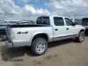 2003 Dodge Dakota SLT с VIN 1D7HG48N13S177855, выставлен на аукционе Copart как лот 62500025 с пробегом 76 678 миль миль и Списание • Salvage title. История ставок и продаж доступна на DreamBid. Изображение 3.