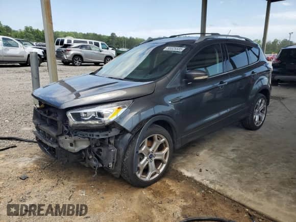 2017 Ford Escape Titanium с VIN 1FMCU0J91HUD04386, выставлен на аукционе Copart как лот 55525535 с пробегом 127 440 миль миль и Списание • Salvage title. История ставок и продаж доступна на DreamBid. Изображение 1.