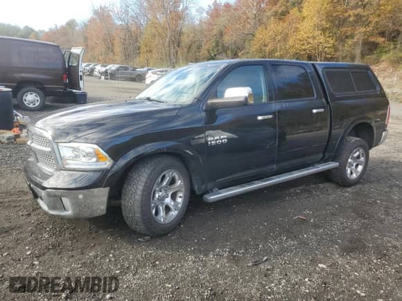 2014 Ram 1500 Laramie с VIN 1C6RR7NTXES368682, выставлен на аукционе Copart как лот 89713075 с пробегом 212 954 миль миль и Списание • Salvage title. История ставок и продаж доступна на DreamBid. Изображение 1.