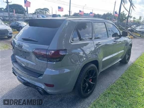 2021 Jeep Grand Cherokee SRT with VIN 1C4RJFDJ0MC537479, listed as a Copart auction lot 57411135 with 53,453 mi miles and Salvage title. Bid and sale history available at DreamBid. Image 4.