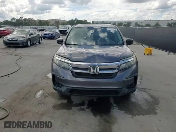 2019 Honda Pilot LX z VIN 5FNYF5H17KB015577, wystawiony jako Copart lot #81332225 z przebiegiem 137 973 mil mil oraz Nie do naprawy • Non repairable. Historia ofert i sprzedaży dostępna na DreamBid. Obrazek 14.