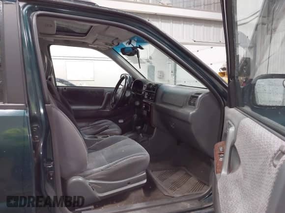 1998 Honda Passport LX with VIN 4S6CM58W9W4419797, listed as a IAAI auction lot 42425697 with 158,562 mi miles and . Bid and sale history available at DreamBid. Image 5.