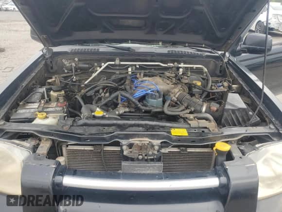 2003 Nissan Frontier SE with VIN 1N6ED27T03C442072, listed as a Copart auction lot 81858225 with 277,583 mi miles and Salvage title. Bid and sale history available at DreamBid. Image 11.