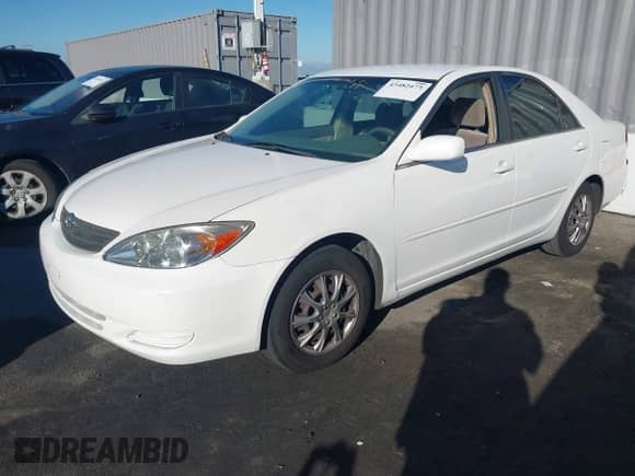 2003 Toyota Camry LE with VIN JTDBE32K730188966, listed as a IAAI auction lot 43482477 with 205,481 mi miles and . Bid and sale history available at DreamBid. Image 2.