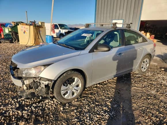 2015 Chevrolet Cruze LS with VIN 1G1PA5SH6F7191119, listed as a Copart auction lot 82159865 with 106,516 mi miles and Salvage title. Bid and sale history available at DreamBid. Image 1.