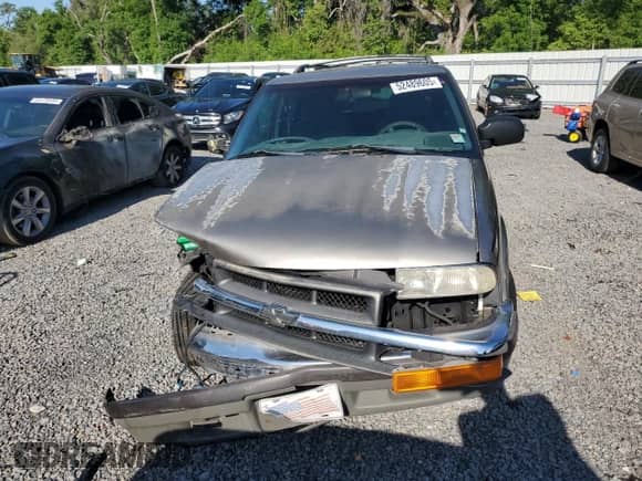 2000 Chevrolet Blazer LS z VIN 1GNCS13W7Y2376702, wystawiony jako Copart lot #52489605 z przebiegiem 137 692 mil mil oraz Szkoda całkowita • Salvage title. Historia ofert i sprzedaży dostępna na DreamBid. Obrazek 5.