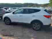 2015 Hyundai Santa Fe z VIN 5XYZTDLB3FG237720, wystawiony jako IAAI lot #43212057 z przebiegiem 143 939 mil mil oraz . Historia ofert i sprzedaży dostępna na DreamBid. Obrazek 14.