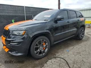 2016 Jeep Grand Cherokee SRT with VIN 1C4RJFDJXGC490918, listed as a Copart auction lot 65140215 with 92,365 mi miles and Salvage title. Bid and sale history available at DreamBid. Image 1.