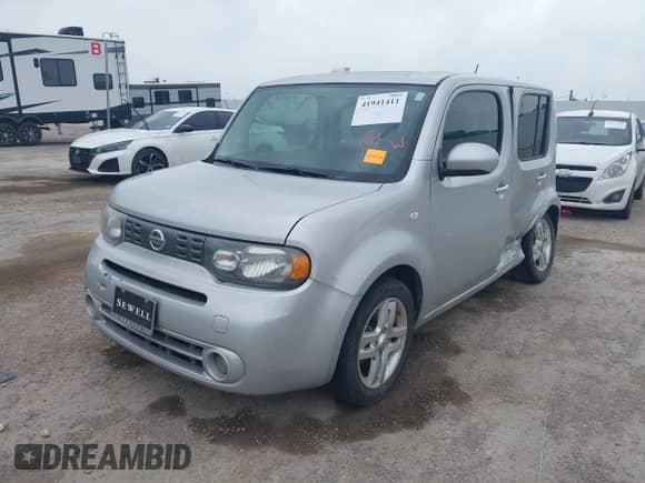 2013 Nissan Cube S with VIN JN8AZ2KR1DT304769, listed as a IAAI auction lot 41941411 with 64,518 mi miles and . Bid and sale history available at DreamBid. Image 2.