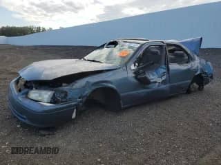 2000 Toyota Camry CE with VIN 4T1BG22KXYU987799, listed as a Copart auction lot 70941635 with Not provided miles and Salvage title. Bid and sale history available at DreamBid. Image 1.