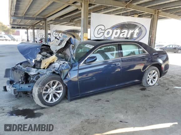 2015 Chrysler 300 Limited with VIN 2C3CCAAG1FH864215, listed as a Copart auction lot 56018625 with 131,861 mi miles and Salvage title. Bid and sale history available at DreamBid. Image 1.