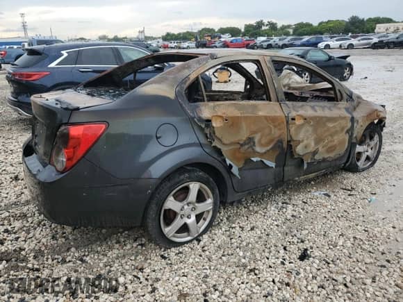 2013 Chevrolet Sonic LTZ с VIN 1G1JE5SHXD4169990, выставлен на аукционе Copart как лот 80101435 с пробегом Не указан миль и На запчасти • Non repairable. История ставок и продаж доступна на DreamBid. Изображение 3.