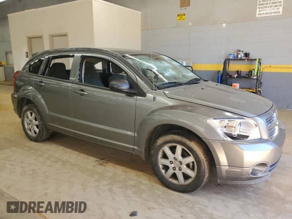 2011 Dodge Caliber Mainstreet with VIN 1B3CB3HAXBD261722, listed as a Copart auction lot 82446015 with 151,548 mi miles and Salvage title. Bid and sale history available at DreamBid. Image 4.
