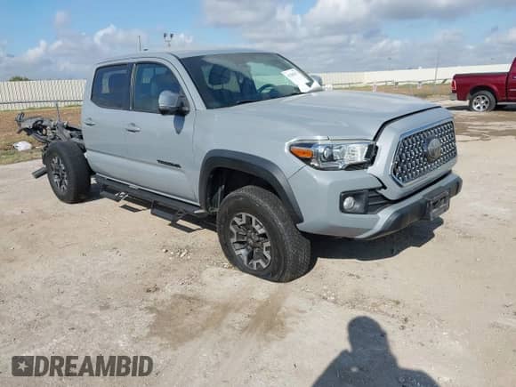 2019 Toyota Tacoma TRD Off Road with VIN 3TMCZ5AN9KM279023, listed as a IAAI auction lot 43200273 with 68,836 mi miles and . Bid and sale history available at DreamBid. Image 1.