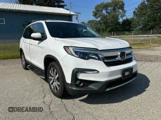 2022 Honda Pilot EX-L with VIN 5FNYF6H50NB018186, listed as a Copart auction lot 80308255 with 147,297 mi miles and Clean title. Bid and sale history available at DreamBid. Image 1.