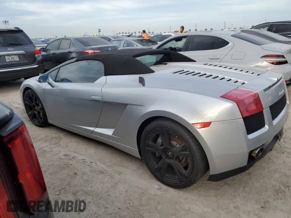 2007 Lamborghini Gallardo с VIN ZHWGU22T57LA05137, выставлен на аукционе Copart как лот 76275354 с пробегом Не указан миль и Списание • Salvage title. История ставок и продаж доступна на DreamBid. Изображение 2.
